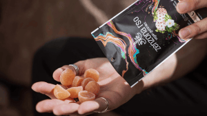 pouring magic mushroom gummies into hand