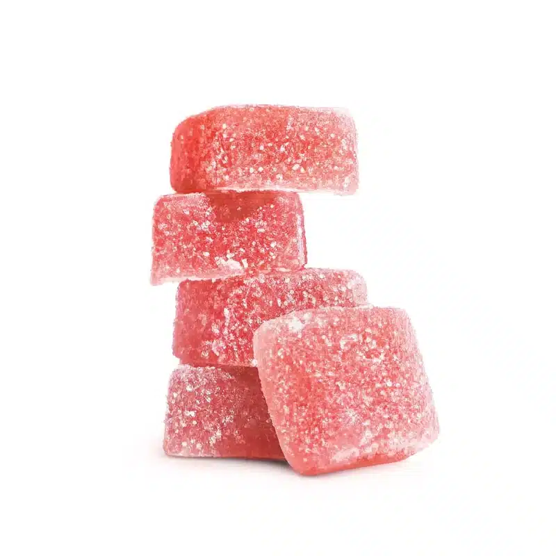 Psilocybin gummies stacked four high with one in front leaning on the rest